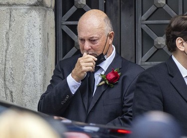 Steve, Shutt, former Montreal Canadiens linemate of Guy Lafleur, watches as limousines leave Mary Queen of the World Cathedral in Montreal following Lafleur's funeral Tuesday, May 3, 2022.