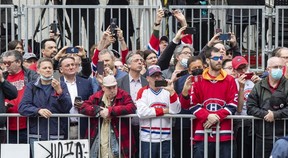 Fans line René-Lévesque Blvd. to watch the funeral for Guy Lafleur at Mary Queen of the World Cathedral in Montreal on Tuesday, May 3, 2022.