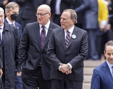 National Hockey League commissioner Gary Bettman, right, and deputy commissioner Bill Daly leave after the funeral for Guy Lafleur at Mary Queen of the World Cathedral in Montreal Tuesday, May 3, 2022.