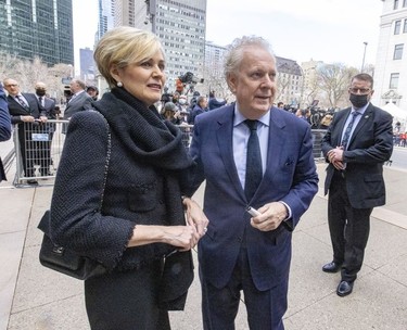 Jean Charest and wife Michélle Dionne arrive for the funeral for Guy Lafleur at Mary Queen of the World Cathedral in Montreal Tuesday, May 3, 2022.