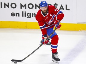 Shea Weber in a Canadiens uniform takes a shot on the ice