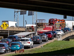 Cars line up to merge eastbound onto the Metropolitan Highway 40 from the Decarie Expressway in this file photo.