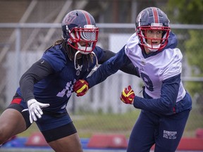 Linebacker Reshard Cliett wears a kaleidoscopic visor while covering receiver Dante Absher during Montreal Alouettes training camp practice in Trois-Rivières on May 26, 2022.