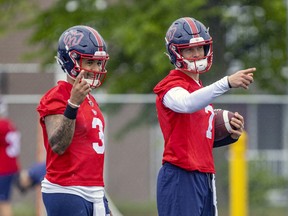 Quarterbacks Vernon Adams Jr., left, and Trevor Harris take part in passing drill during Montreal Alouettes training camp practice in Trois-Rivieres, east of Montreal Thursday May 26, 2022.