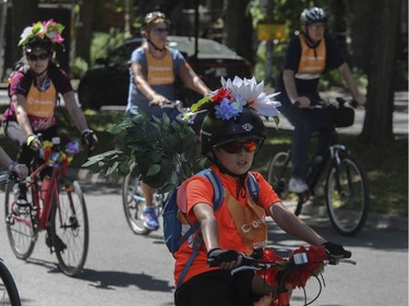 MONTREAL, QUE.: JUNE 5, 2022 --A youngster  and others leave the Lafontaine Park area for the Tour de l'Île in Montreal Sunday, June 5, 2022. There were three departure points around the city, and people did a 36-km loop.