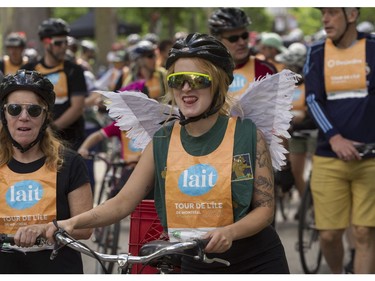 A winged Gabie Allain and others prepare to leave the Lafontaine Park area for the Tour de l'Île in Montreal on Sunday, June 5, 2022.