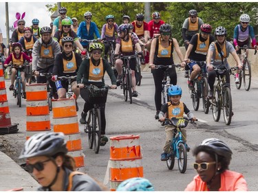 People ride in Westmount as they took part in the Tour de l'Île in Montreal on Sunday, June 5, 2022.