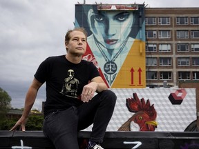 Mural Festival artist Shepard Fairey, with one his works in Montreal on Wednesday, June 8, 2022.