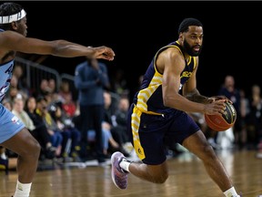 Stingers' Adika Peter-McNeilly races past Alliance's Kemy Ossé during a Canadian Elite Basketball League game Wednesday night in Edmonton.