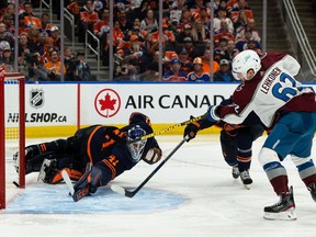Artturi Lehkonen of the Colorado Avalanche scores over Mike Smith of the Edmonton Oilers during overtime in Game 4 of NHL Western Conference finals action at Rogers Place in Edmonton on June 6, 2022.