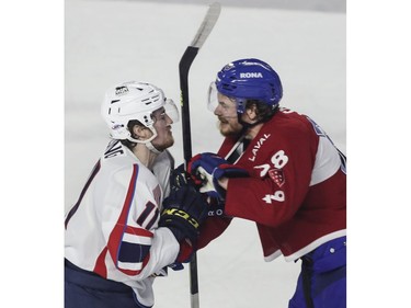 Nate Schnarr of the Laval Rocket (right) and  Hugh McGing of the Springfield Thunderbirds exchange words in the first period of Game 4 of their Calder Cup Eastern Conference AHL final at Place Bell in Laval on Friday, June 10, 2022.