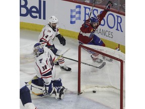 Rocket's Cédric Paquette celebrates his second-period goal that beat Thunderbirds goalie Joel Hofer as defenceman Tommy Cross chases the play Friday night, June 10, 2022, at Place Bell in Laval.