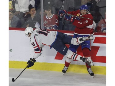 Laval Rocket defenceman Tobie Paquette-Bisson sends Mackenzie MacEachern on the Springfield Thunderbirds flying during play in Game 4 of their Calder Cup Eastern Conference AHL final at Place Bell in Laval on Friday, June 10, 2022.