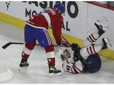 Will Bitten of the Springfield Thunderbirds and Louie Belpedio of the Laval Rocket tangle late in the third period of Game 4 of their Calder Cup Eastern Conference AHL final at Place Bell in Laval on Friday, June 10, 2022.