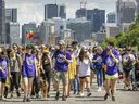 People take part in a Spirit Walk in support of the Native Women's Shelter of Montreal on Mount Royal in Montreal on Saturday June 11, 2022.