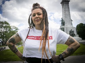 Alice Lacroix is seen at the foot of the George-Étienne Cartier monument on Friday, June 10, 2022. Lacroix is organizing a topless demonstration next weekend to show solidarity with a young Quebec City woman who was questioned by police for removing her shirt on a hot, sunny day.