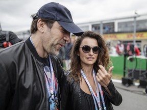 A-list actors Javier Bardem and Penelope Cruz walk the starting grid before the start of the 2016 Canadian Grand Prix on Île Notre-Dame.