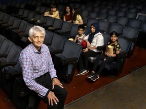 Dollar Cinema owner Bernie Gurberg, left, at his cinema that will close its doors at the end of July. He is seen here with clients Andrea Calian, top left to right, Loren Gomez, Jessica Cataldo, Fathima Mohamed with children Amhar Ali, and Alima, waiting for the noon showings to start.