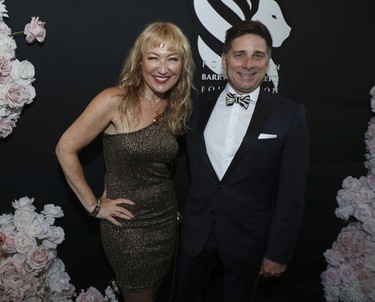 Nathalie Schwartz and husband Charles Décarie, Chief Operating Officer at Triotech, pose for a photo at the Grand Prix Party at the Ritz-Carlton Hotel in Montreal on June 17, 2022.