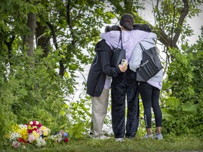Friends and classmates pay their respects Wednesday, June 22, 2022 near the spot where Adalya Dorvil, 17, was found in LaSalle the previous day.