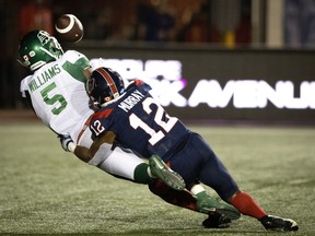 Montreal Alouettes defensive back Najee Murray (12) takes down Saskatchewan Roughriders wide receiver D’haquille Williams (5) preventing Williams from completing the touchdown during CFL action in Montreal on Thursday, June 23, 2022.