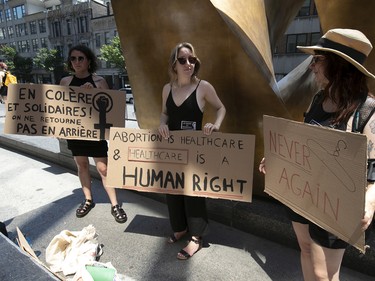 Montrealers take part in a pro-choice protest outside Palais de Justice on Sunday, June 26, 2022. The protest was in response to the U.S. Supreme Court overturning Roe v. Wade on Friday.