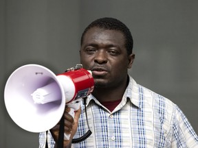 Mamadou Konaté speaks to the media as he reports to the federal immigration office, facing possible deportation, in Montreal on June 27, 2022.