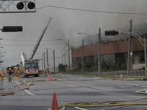 Montreal firefighters at the scene of five-alarm fire at a former recycling centre in Montréal-Est on Sunday June 26, 2022.