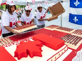 Montrealers of all nationalities took part in the Canada Day Parade in Montreal on July 1, 2019, the last time it was held. Volunteers Christine Busby, Dorothy Champagne, and Jean Harry unboxed and guarded the birthday cake that was given out to the public at Place du Canada at the finish of the parade.