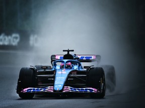 Fernando Alonso of Spain driving the (14) Alpine F1 A522 Renault in the wet during final practice ahead of the F1 Grand Prix of Canada at Circuit Gilles Villeneuve on June 18, 2022 in Montreal, Quebec.