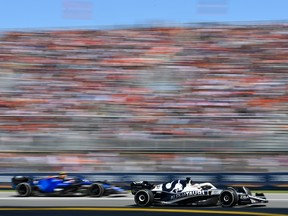 Pierre Gasly's Scuderia AlphaTauri AT03 leads Nicholas Latifi's Williams FW44 Mercedes during Canadian Grand Prix at Circuit Gilles-Villeneuve in in Montreal on June 19, 2022.