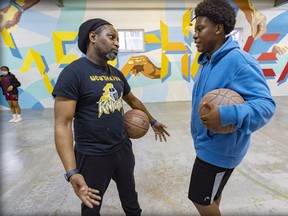 Basketball coach and teen program co-ordinator Stephen Hennessey speaks with Kaisen Coke at the Westhaven Elmhurst Community Recreation Association in N.D.G. Hennessy last saw Jannai the Friday before he was killed. He had stopped by to shoot some hoops. “He came with his cousin, who still comes on a regular basis,” he recalled. “They were always really cool and respectful.”