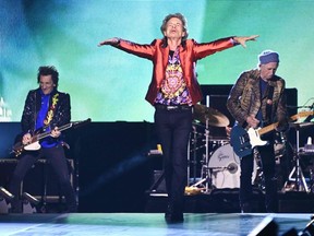 (From L) Members of the Rolling Stones Ronnie Wood, Mick Jagger and Keith Richards during their concert as part of their European tour, in Madrid on June 1, 2022.