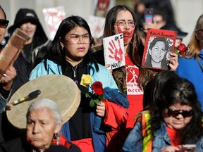 In this file photo, women in Vancouver march to honour the lives of missing and murdered Indigenous mothers, daughters, sisters and aunties.