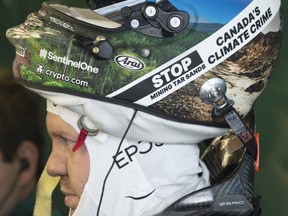 Aston Martin Formula 1 driver Sebastian Vettel, of Germany, wears a patch on his helmet denouncing Canada’s oil sands during the first practice session at the Canadian Grand Prix Friday, June 17, 2022 in Montreal.