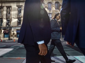 Office workers are seen in the financial district in Toronto in this September 2021 file photo.