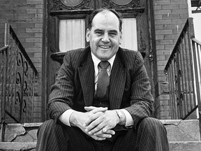 George Springate sits on the stairs of his childhood home in Montreal's Pointe-St-Charles district in 1981.