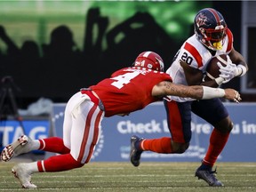 Alouettes running-back Jeshrun Antwi gets past Stampeders linebacker Cameron Judge during second-half action last week in Calgary.