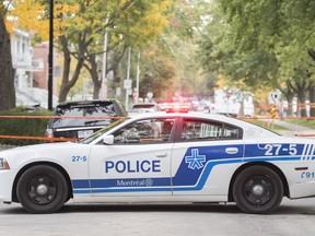 A police cruiser is shown on a street in Montreal North, Sunday, October 4, 2020. THE CANADIAN PRESS/Graham Hughes
