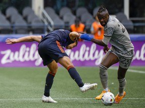 CF Montreal forward Kei Kamara (23) steals the ball from Seattle Sounders FC defender Jackson Ragen (25) during the first half at Lumen Field June 29, 2022.