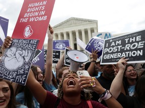 Anti-abortion demonstrators celebrate outside the United States Supreme Court as the court rules in the Dobbs v Women's Health Organization abortion case, overturning the landmark Roe v Wade abortion decision in Washington, U.S., June 24, 2022.