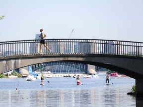 People exercise at The Charles River Esplanade as the U.S. East Coast is hit by a heat wave, in Boston, Mass. on May 22, 2022.