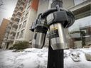 Lock boxes, left for tourists to access rental units, are seen hung on a parking meter in downtown Montreal in 2019.