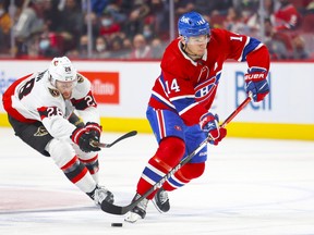Montreal Canadiens centre Nick Suzuki skates away from Ottawa Senators' Connor Brown during first period in Montreal on April 5, 2022.