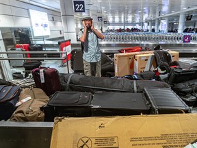 Montrealer Jacques Bernier looks for but did not find his bike at Trudeau Airport in Dorval on Wednesday June 29, 2022. Dave Sidaway / Montreal Gazette