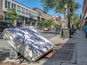 A mattress left on the curb during moving day in Montreal on July 1, 2021.