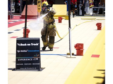 Pierre-Yves Lebeau of the Bedford fire dept easily wins his event as he takes part in the Canadian Firefit Championships and picnic day, in Montreal, on Saturday, July 2, 2022.
