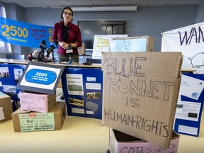 Catherine Lussier of the housing rights group FRAPRU speaks at a protest event calling for social housing on Blue Bonnets land in Montreal on Tuesday, July 5, 2022.