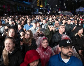 A crowd braves the rain to listen to the Nathaniel Rateliff & the Night Sweats concert at the Montreal Jazz Festival on Tuesday, July 5, 2022.