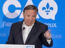 Quebec Premier François Legault answers questions at event introducing Pascale Déry as the CAQ candidate in Repentigny July 5, 2022.